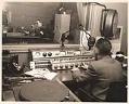 Image of Two men in KIRO Radio broadcast booths, Seattle,  circa 1945