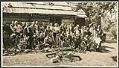 Image of Pacific Northwest Cycling Association group in front of cabin, circa 1950