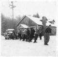 Image of Pacific Northwest Cycling Association group pulling a car in the snow, Glacier, Washington, January 1, 1950