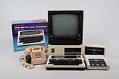 Image of TRS-80 Model 100 portable computer and peripherals, ca. 1983