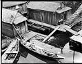 Image of Canoes at boathouse, Seattle, circa 1900