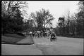 Image of Runners and wheelchair racer in 10K race, probably in Seattle, July 1, 1986