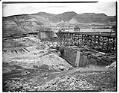 Image of Trestles and traveling cranes at dam construction site, circa 1937