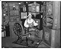 Image of Woman spinning in Swedish Folk Art exhibition, February 1937