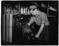 Image of Man shaping a hat at the J.T. Hardeman Hat Company, Seattle, 1935
