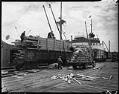 Image of Truck and railroad car with cargo, Seattle, 1934