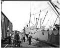 Image of Men unloading cargo from ship, circa 1935