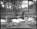 Image of Girls with swans at Woodland Park Zoo, Seattle, 1937