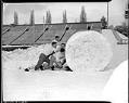 Image of University of Washington football players rolling snowball, Seattle, 1947