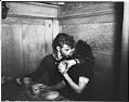 Image of Sailor kissing girl during blackout, Seattle, 1941