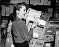 Image of Nola Hines with ration book, Seattle, 1942