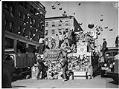 Image of Pots and pans flying through the air during scrap drive, July 1941