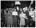 Image of Group displaying V-J Day newspapers, August 14, 1945