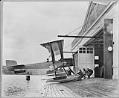 Image of Men pulling B & W into Boeing Seaplane Hangar on Lake Union, Seattle, 1916
