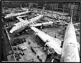 Image of Boeing 747 assembly plant showing four 747s under construction, Everett, circa 1969