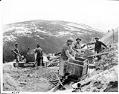 Image of Men using rockers to pan for gold, circa 1898