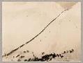 Image of Packers ascending summit of Chilkoot Pass, 1898