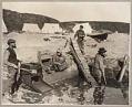 Image of Group of miners using conveyor and rockers, circa 1899