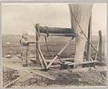 Image of Child near mining equipment, Nome, August 30, 1906