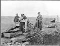 Image of Three men and a rocker in the Nome gold fields, circa 1905