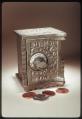 Image of Coin bank in the shape of a floor safe, ca. 1900