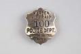 Image of Air Raid Warden's badge #100, Police Department, City of Seattle, ca. 1940