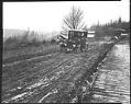 Image of Car stuck on muddy road, circa 1927