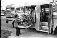 Image of Student in wheelchair using lift on school bus, Federal Way, September 23, 1983
