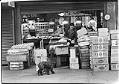 Image of Vendor with boxes of produce at Pike Place Market, Seattle, September 23, 1983