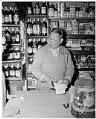 Image of Lung Sing Luke in his grocery store at 920 James Street, Seattle, February 26, 1960
