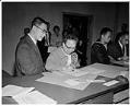 Image of Mrs. Lew Fung Hai Luke and her son Wing Luke at Federal Courthouse, Seattle,  October 21, 1963