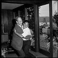Image of Jim Whittaker embraces Nawang Gombu, Seattle, 1963