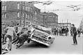 Image of Students overturning car in Earth Day demonstration outside Seattle Community College, Seattle, 1970