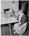 Image of Two people working on mosaics for the Handicapped Center Christmas Bazaar, Seattle, November 8, 1962