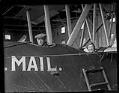 Image of Eddie Hubbard and unidentified man in mail plane, Seattle, circa 1919