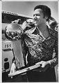 Image of Lenny Wilkens with championship trophy after arriving at Sea-Tac airport, June 2, 1979