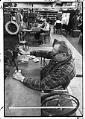 Image of Paul Koyne at a drill press making parts for Boeing at the United Cerebral Palsy machine shop, Seattle, October 1975