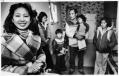 Image of Baptist missionary Hanh Nguyen with Giu Vo and her family in their apartment, Seattle, March 1982