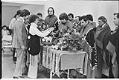 Image of Mourners placing gifts on bier at funeral for Kathleen Bishop, Port Townsend, February 16, 1978