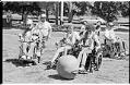 Image of People in motorized wheelchairs playing soccer, Seattle, July 28, 1985​