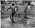 Image of Electrics soccer team playing in the mud at Woodland Park, Seattle,  November 2, 1975