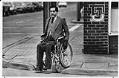 Image of Martin J. Weideman using a curb ramp, Seattle, February 1981