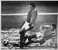 Image of Seattle Hungarians'  Brian Franklin with Boeing Employees opponent in the rain on a West Seattle field, December 15, 1968