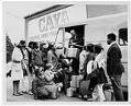 Image of Girls with luggage outside the Central Area Youth Association (CAYA) building, Seattle, April 5, 1968