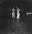 Image of Dancing women in grass skirt costumes, Seattle, June 22, 1944