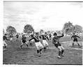 Image of Mrs. Wickman's Pie soccer team playing game with unidentified team, Seattle, October 1940